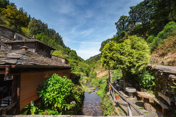 Fototapeta na wymiar Teixois village, Los Oscos, Asturias. Ethnographic Site dates from the 18th century and is based on the integral use of the hydraulic energy of the river.