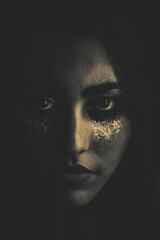 Black and white dark moody portrait of a beautiful and sexy woman face. Make up with shiny glitter tears. Beautiful crying. Concept of sadness, despair, pain, and drama queen. Retro style. 