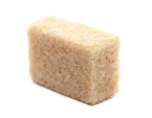 Brown cane sugar cube isolated on white background