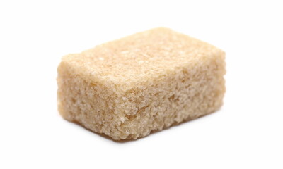 Brown cane sugar cube isolated on white background