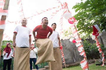 Sack race participants jumped each other by jumping to quickly reach the finish line in the celebration of August 17 Indonesian Independence Day