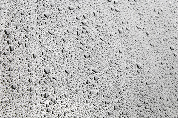 Water drops on a light surface, selective focus. Raindrops, fresh background