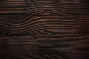Wooden brown background. Board. Abstract brown background. The surface is made of wood. Polished wood.