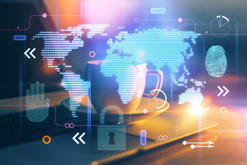 Double exposure of desktop with computer and world map hologram. International data network concept.