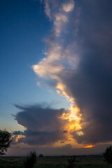 Clouds in the sky. The sun in the clouds. A look through the clouds. The clouds are floating towards the sun. The path to god. Thick steam texture. Thick fog. Sunset soon. High in the sky