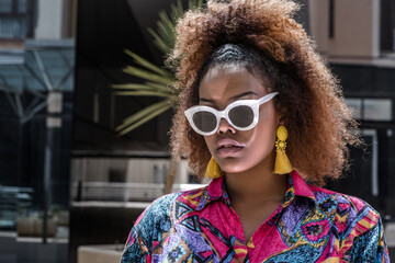 Cool African American woman in stylish outfit