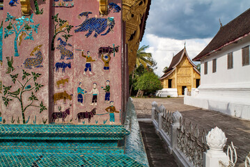 Colorful glass mosaics at the back of Vat Xieng Thong Pagoda in Luang Prabang, Laos