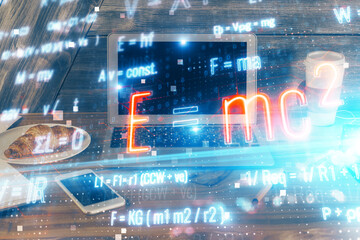 Desktop computer background and formula hologram writing. Double exposure. Education concept.