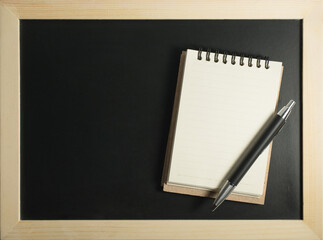 pen and book notes blackboard background style light and shadow