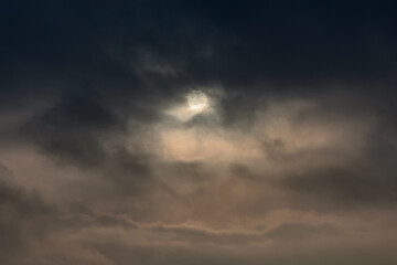 Fototapeta na wymiar sun covered by smog in city