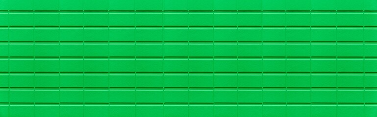 Panorama of Modern pattern of green stone block wall tile texture and seamless background