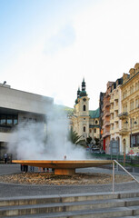 Geyser and hot spring colonnade in Karlovy Vary. Bohemia. Czech Republic