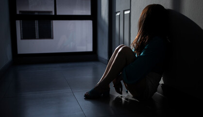 Sad young woman sitting in the house, People with depression concept.	