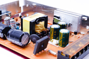 Power supply for LED strip. Power supply unit view from noodle. Capacitors, power supply components...
