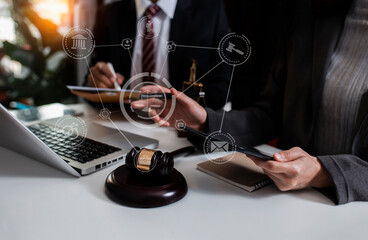 Concept of Law and Legal services. Lawyer working on digital at table office.