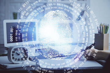 Blue fingerprint hologram over hands taking notes background. Concept of security. Double exposure