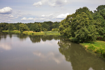 Fototapeta na wymiar Nysa Luzycka (Lausitzer Neisse) river at Park Muzakowski (Park von Muskau) near Leknica. UNESCO World Heritage Site. Poland
