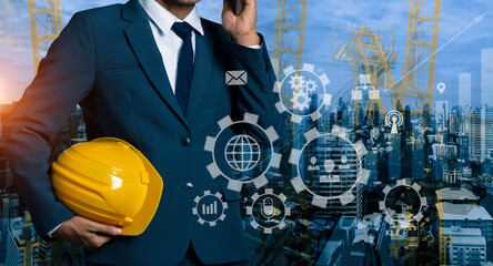 Double exposure engineering using digital technology interfaces icon with construction cranes no city background.	