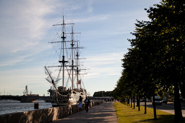 Sailing ship of the coast of a big city.