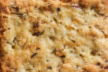 Macro effect photo. Wheat dry biscuits with spices on a wooden table