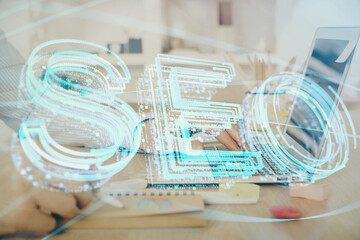 Double exposure of seo icon with man working on computer on background. Concept of search engine optimization.