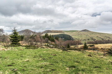 Volcans d'Auvergne regional natural park in early spring. Monts Dore Mountains, Auvergne, France.