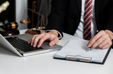 Concepts of Law and Legal services.	Lawyer working at table office.