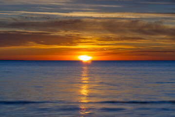 Fototapeta na wymiar Sunset at the Baltic sea shore in a summer time, Estonia. soft focus.