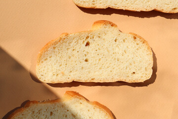 Pieces of bread on a beige background