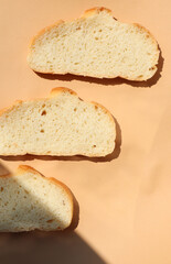 Pieces of bread on a beige background