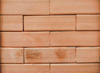 closeup of orange color brick wall in modern house architecture.brick wall background with orange...