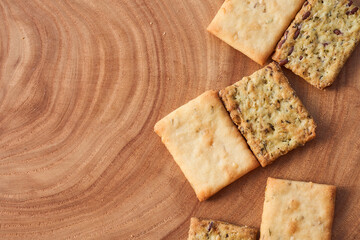 Wheat dry biscuits with spices on a wooden table