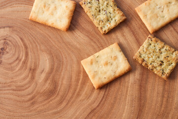 Wheat dry biscuits with spices on a wooden table