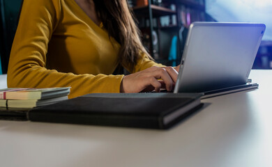 Hands of business people working with laptop computer at office table. Business and technology concept.