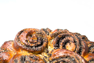 brioche with poppy seeds on white background. copy space