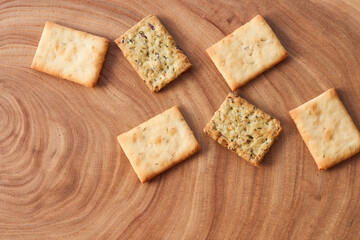 Wheat dry biscuits with spices on a wooden table