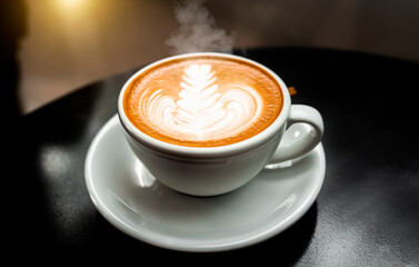 Cup of coffee latte isolated on black background	