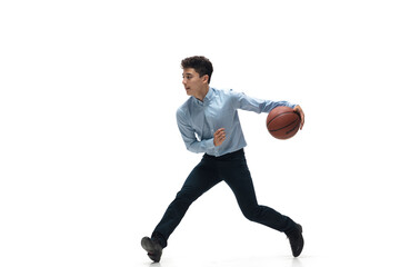 Fototapeta na wymiar Boss. Man in office clothes playing basketball on white background like professional player, sportsman. Unusual look for businessman in motion, action with ball. Sport, healthy lifestyle, creativity.