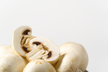 Fototapeta na wymiar Fresh champignon mushrooms macro shoot. Close-up white champignon.