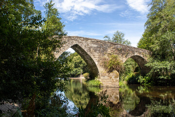 Fototapeta na wymiar Medieval stone bridge of San Alberte over the river Parga in Lugo Spain