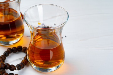 Cup of tea with islamic pray beads