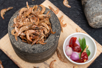 Dried shrimp, prawn sun-dried Kerala India. Dry seafood to make coconut prawn Chutney, Chammanthi. Top view Indian non vegetarian food ingredient fish soups, shrimp paste.