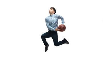 Achieves. Man in office clothes playing basketball on white background like professional player, sportsman. Unusual look for businessman in motion, action with ball. Sport, healthy lifestyle