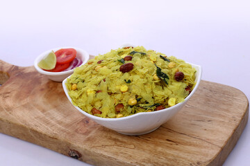 Indian Traditional Spicy And Sweet Mixture Namkeen Also Know as Chivda, Farsan, Namkin, Chiwada, or nylon chevdo on wooden 