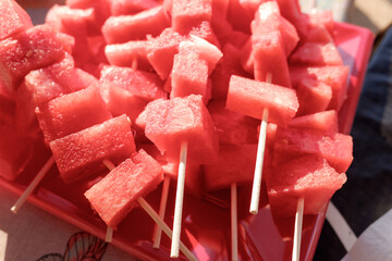 Fresh diced watermelon and skewered as a snack.
