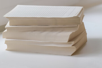 A stack of paper lined forms for accounting