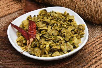Clam, mussel , scallop shellfish meat raw for Fish curry seafood South Indian recipe Kerala India.  Popular cuisine or dish in coastal area restaurants . 