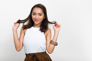 Studio shot of young beautiful Asian woman