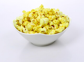 Tasty popcorn in a bowl isolated on dark Background. Snack for a movie