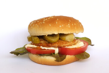 Hamburger - a type of sandwich consisting of a bun cut in half and chopped fried cutlet with tomato, cucumber and mayonnaise